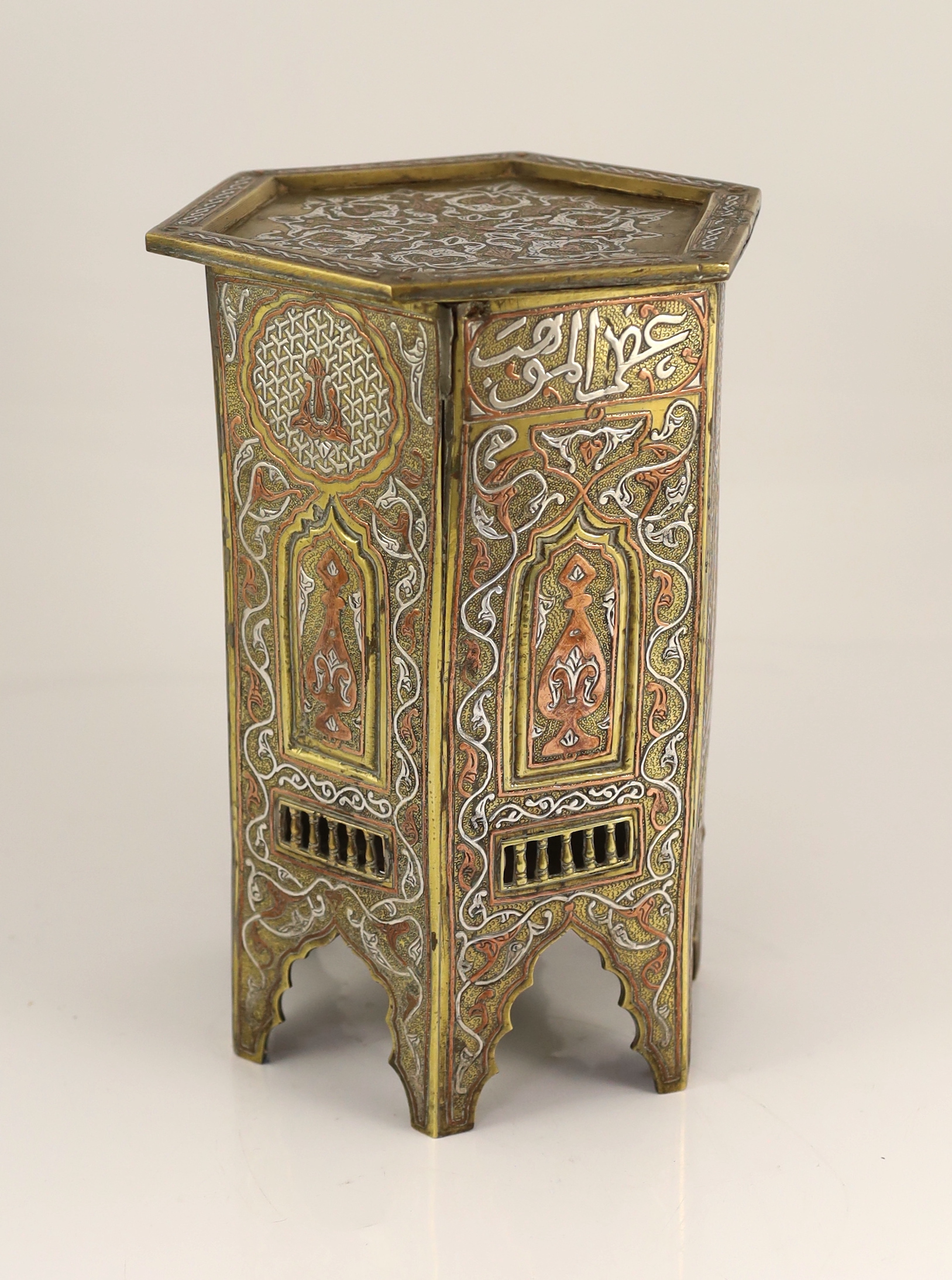 A Cairo ware silver and copper inlaid brass Qur’an stand, early 20th century